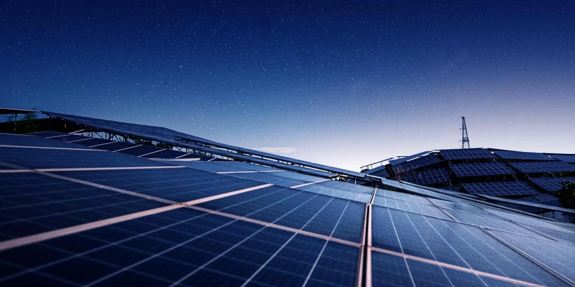 Close view of solar panels across a utility solar array